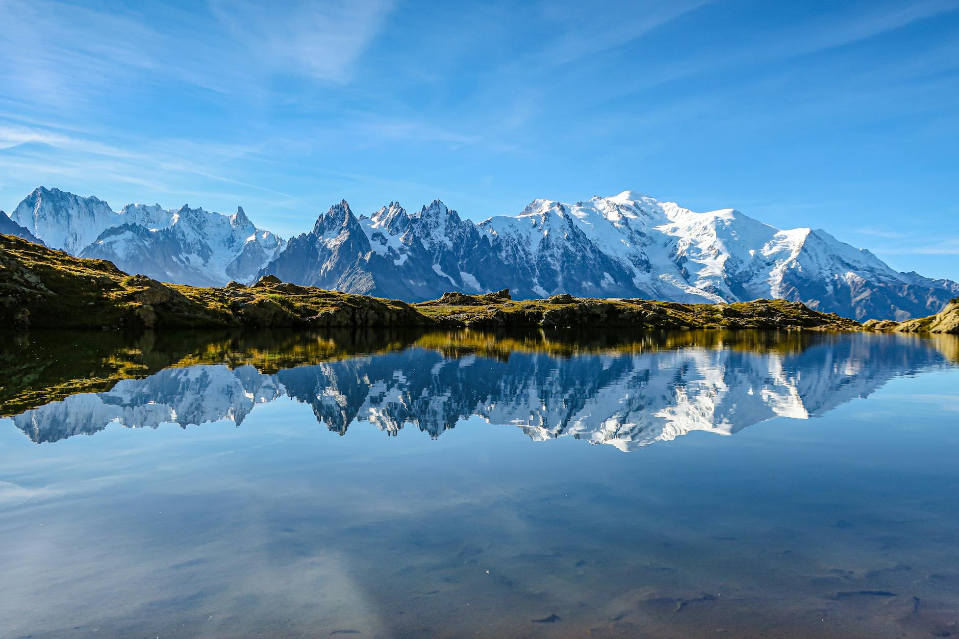 Beautiful reflection of Mont Blanc in a serene lake in Chamonix, France under a clear blue sky. (Photo: Manon Ridet / Pexels)