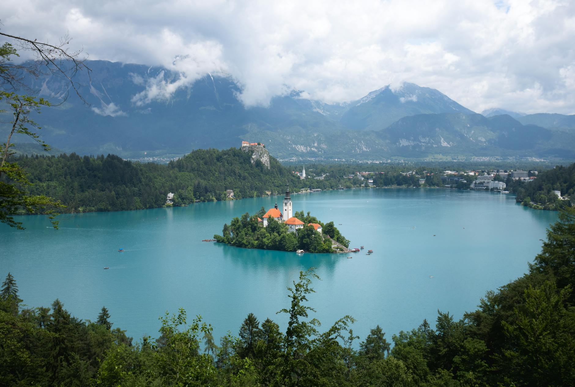 Stunning panoramic view of Lake Bled with its iconic island church and surrounding mountains.